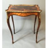 A MID 19TH CENTURY FRENCH COROMANDEL AND KINGWOOD CENTRE TABLE The serpentine brass galleried top