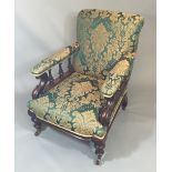 A 19TH CENTURY MAHOGANY OPEN ARMCHAIR In emerald green foliate upholstery, the scrolling arm