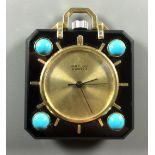VAN CLEEF & ARPELS, CIRCA 1940, AN 18CT GOLD TRAVEL WATCH The yellow metal dial with sunburst design