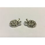 TIFFANY & CO., A PAIR OF PALLADIUM AND DIAMOND CLUSTER EARRINGS Each cluster has a central