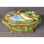 MINTON, A LATE 19TH CENTURY MAJOLICA POTTERY GAME PIE DISH AND COVER oval shape with basket weave