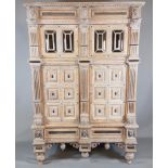 A 19TH CENTURY FRENCH LIMED OAK AND EBONY FOUR DOOR CABINET Over two drawers, the cornice carved