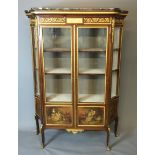 A 19TH CENTURY FRENCH KINGWOOD AND ORMOLU MOUNTED VITRINE Having a black marble top over central