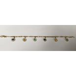 AN 18CT GOLD, DIAMOND AND MULTI GEM SET BRACELET The six coloured gemstones (two sapphires, two