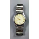 OMEGA, A GENTLEMAN'S VINTAGE WRISTWATCH The silvered dial with Omega logo, yellow metal batons and