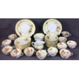 AN EARLY 20TH CENTURY ROYAL WORCESTER PORCELAIN TEA SERVICE Having a wide cream border, hand painted