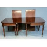 AN EARLY 19TH CENTURY MAHOGANY CAMPAIGN DINING TABLE With telescopic action and three extra