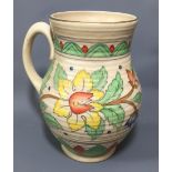 CHARLOTTE RHEAD, A 20TH CENTURY POTTERY JUG With tube lined foliate decoration on a cream ground. (h