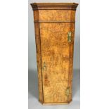 AN 18TH CENTURY STYLE FIGURED WALNUT CORNER CUPBOARD The single door fitted with brass hinges and