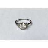 A MID 20TH CENTURY PLATINUM AND DIAMOND SOLITAIRE RING The oval cut diamond claw set between