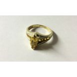 A HALLMARKED 9CT GOLD, CITRINE AND DIAMOND DRESS RING The marquis cut citirine claw set between