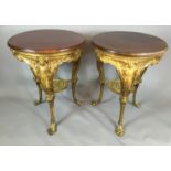 A PAIR OF VICTORIAN MAHOGANY OCCASIONAL TABLES The circular tops raised on a gilt metal bases with