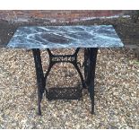 A VICTORIAN MARBLE TOPPED TABLE converted from a treadle sewing machine , on wrought iron base 87