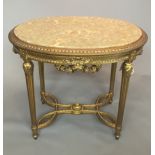 A 19TH CENTURY DESIGN FRENCH OVAL OCCASIONAL TABLE With inset faux cream marble top and gilt base