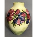 A 20TH CENTURY MOORCROFT POTTERY VASE Tube lined decoration of anemone flowers on a yellow ground,