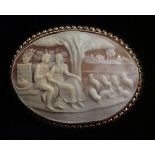 AN EARLY 20TH CENTURY 9CT GOLD SIGNED OVAL SHELL CAMEO BROOCH Finely carved with a landscape view of