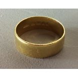 A VINTAGE 22CT GOLD WEDDING BAND Of large size and plain design, marked 'Albion' (size W/X).