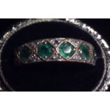 A VINTAGE 14CT GOLD, EMERALD AND DIAMOND HALF ETERNITY RING Having five round cut emeralds,