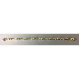 A 9CT GOLD FANCY LINK BRACELET Spherical design,flanked by pairs of pierced rings interspersed