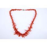 A GRADUATED BRANCH CORAL NECKLACE With a 9ct gold clasp. (l 51cm)