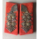 A PAIR OF EARLY 20TH CENTURY GERMAN GENERALS COLLAR INSIGNIA Gold bullion thread design on red