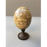 AN EARLY 20TH CENTURY MOUNTED OSTRICH EGG