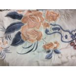 AN LATE 19TH/20TH CENTURY CHINESE EMBROIDERED SILK SHAWL Cream ground with peach and purple floral