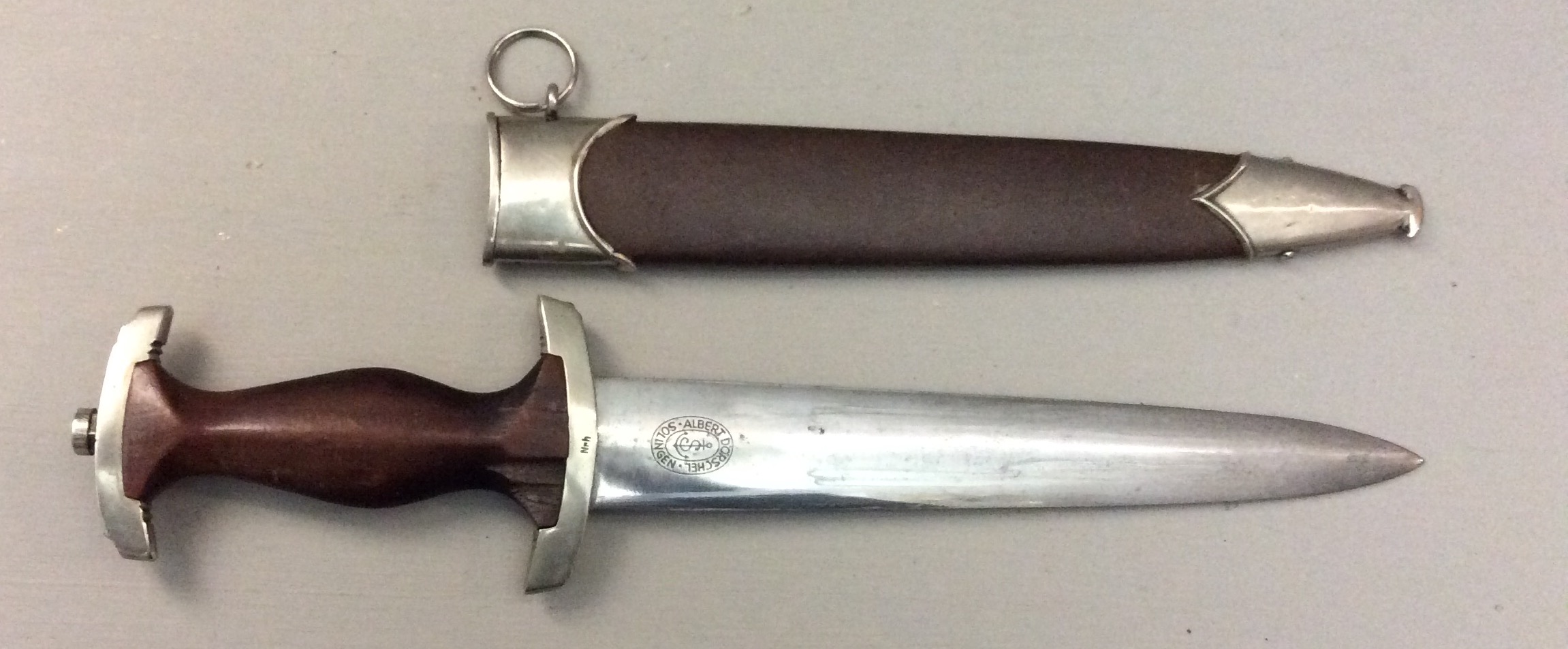 A WORLD WAR II GERMAN SA DAGGER Brown wooden grip with solid nickel fittings and brown leather - Image 6 of 10