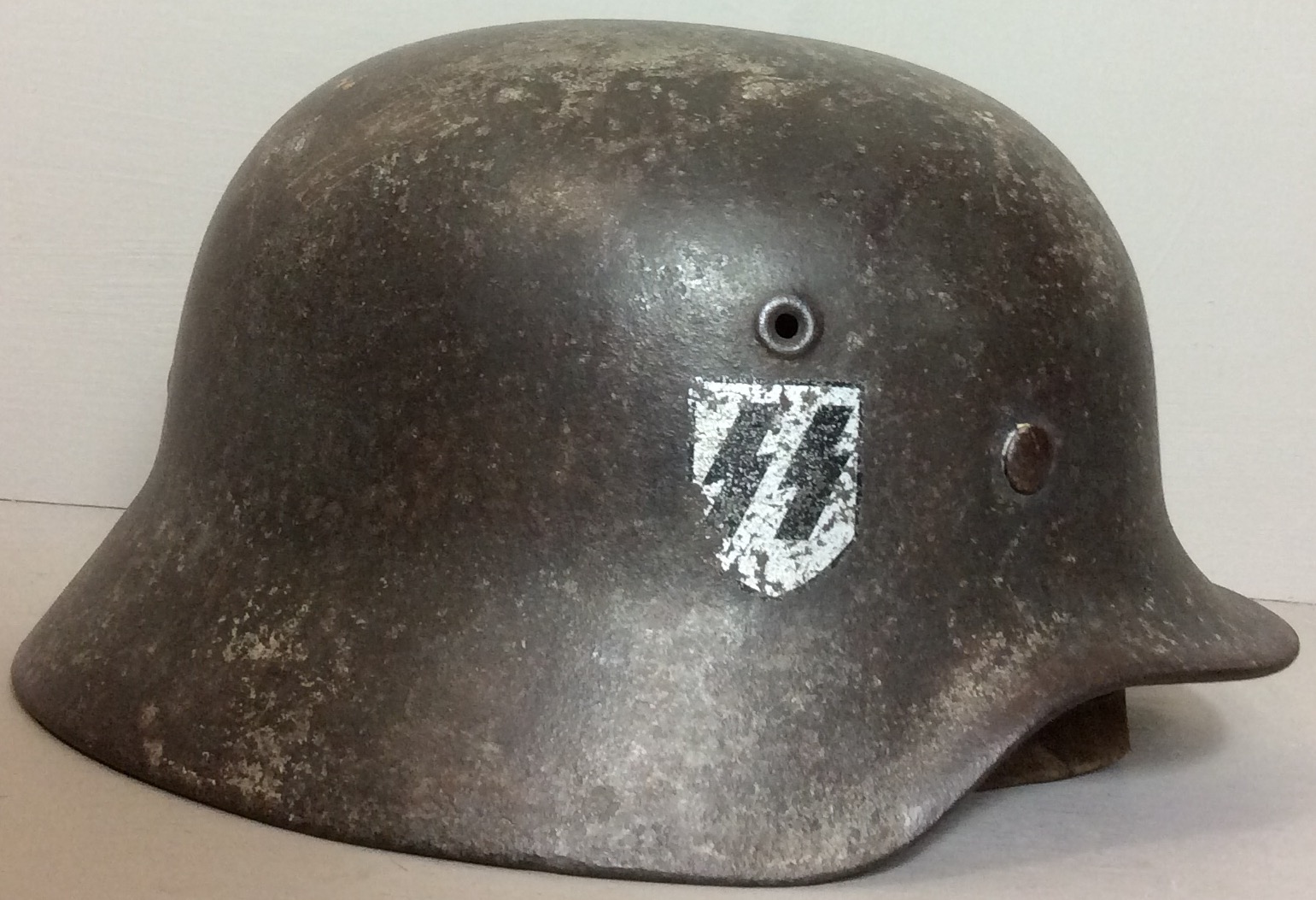 A WORLD WAR II GERMAN DOUBLE DECAL HELMET OF NEDERLAND DIVISION WAFFEN SS Having German SS and Dutch