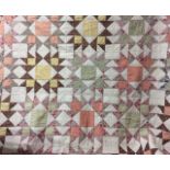 A VICTORIAN PATCHWORK QUILT The central field of geometric style Chintz panels on a pale green