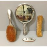 W.G. SOTHERS & CO., AN ART DECO SILVER VANITY SET Comprising two brushes and a vanity mirror with