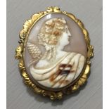 A 19TH CENTURY CAMEO BROOCH Depicting a Greek lady with vine leaves in her hair, contained in a