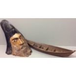 A 20TH CENTURY WOODEN TREE STUMP CARVED AS A WIZARD The hat having a recessed space for a plant pot,