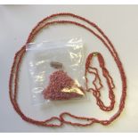 TWO RED CORAL NECKLACES Along with loose beads. (l 160cm)