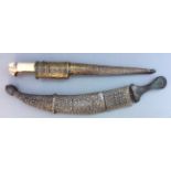 TWO ANTIQUE PERSIAN DAGGERS One with a white metal mounted wooden handle, the scabbard having