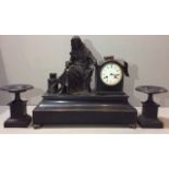 A 19TH CENTURY FRENCH BLACK MARBLE THREE PIECE CLOCK GARNITURE Mounted with a bronze statue of a