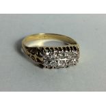 A VINTAGE 18CT GOLD AND DIAMOND RING Having two rows of five round cut diamonds claw set and