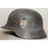 A WORLD WAR II GERMAN DOUBLE DECAL HELMET OF NEDERLAND DIVISION WAFFEN SS Having German SS and Dutch