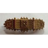 A VICTORIAN 15CT SATIN GOLD ETRUSCAN STYLE RECTANGULAR BROOCH With applied decoration and a beaded