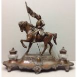 AUGUSTE BOSSU, FRENCH, A 19TH CENTURY SPELTER FIGURAL INKWELL Having a seated equestrian figure