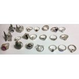 A COLLECTION OF TWENTY-ONE WHITE METAL AND SILVER RINGS Each set with coloured stones/marcasite.