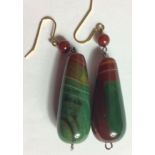 A PAIR OF 20TH CENTURY BANDED OVOID AGATE EARRINGS With green and red banding. (approx 5cm)