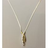 A 9CT GOLD AND DIAMOND PENDANT ON CHAIN The bicolour pendant set with three diamonds, suspended from