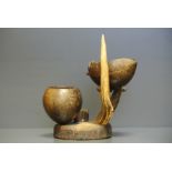 A LATE 19TH/EARLY 20TH CENTURY COCONUT AND ANTLER ART PIECE Original use unknown. (h 23cm x w 22cm x