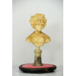 A 19TH CENTURY WAX PORTRAIT BUST OF A LADY Wearing an elaborate headdress and lace collar, raised on