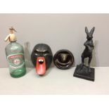 A 20TH CENTURY BRONZE STATUE OF A RABBIT Standing on hind legs and raised on a black marble base,
