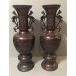 A PAIR OF JAPANESE MEIJI PERIOD BRONZE VASES, 1868 - 1912 With flared necks above handles formed