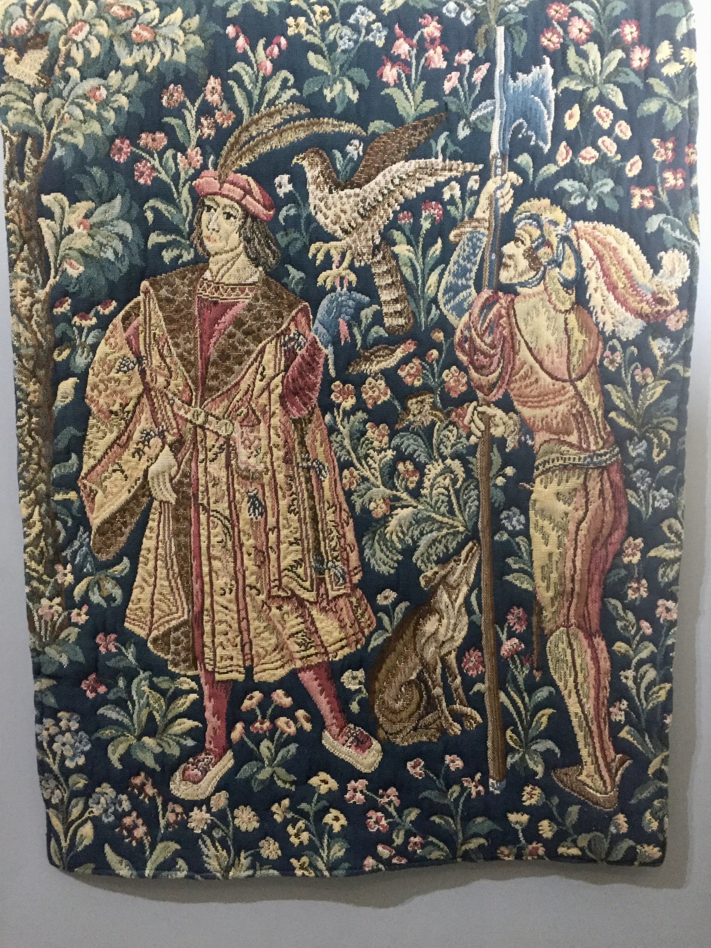 A 16TH CENTURY DESIGN TAPESTRY WALL HANGING Depicted as huntsmen amongst birds and foliage on a blue