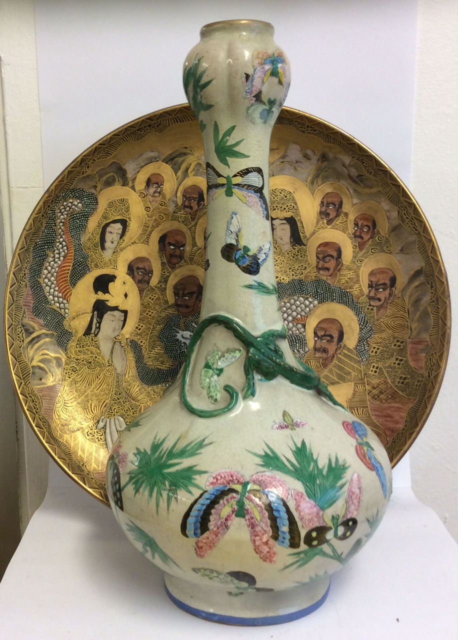 A 19TH CENTURY JAPANESE SATSUMA POTTERY CHARGER Hand painted in gilt with immortals and dragon,