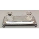 AN EDWARDIAN SILVER AND CUT CLASS RECTANGULAR INKSTAND With a gadrooned border, set with two